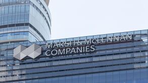 Marsh & Mclennan Companies logo atop of their building in downtown Toronto.