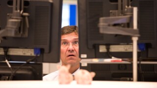 An equity trader at the screen of his computer, Frankfurt am Main, Germany