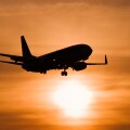 Aircraft against setting sun