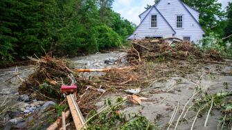 Plainfield, Vermont, USA. 11 July, 2024. Flood debris surrounds a house on Brook Road in Plainfield, VT, USA, after torrential rains from the remnants of Hurricane Beryl hit central Vermont, USA. John Lazenby/Alamy Live News