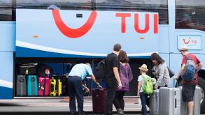 Tui coach driver loading luggage at airport in Spain