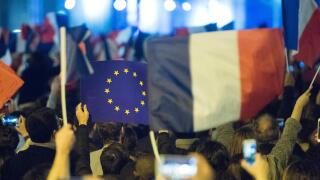 EU flags and France flags shown on a demonstration in Paris.