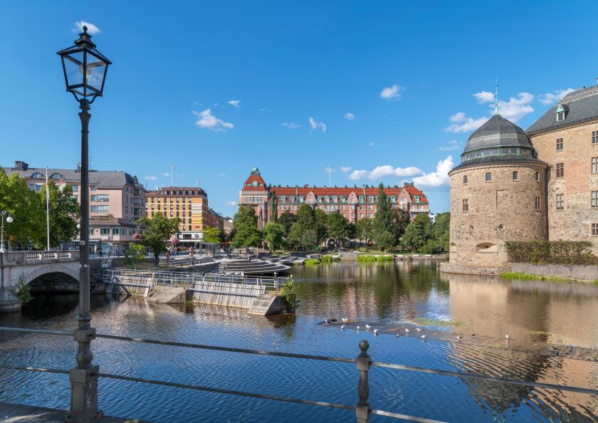 The city centre and Svartan river with Orebro Castle to the right, Orebro, Narke, Sweden