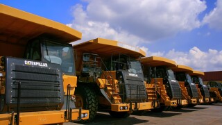 caterpillar truck neatly parked with blue sky background. Image shot 02/2009. Exact date unknown.