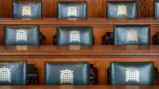 Empty seats in the Palace of Westminster. House of Commons meeting room.
