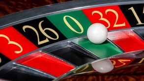 Classic casino roulette wheel with sector zero and white ball