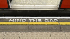 Mind the Gap Warning Sign on the Platform Edge of a London Underground Station.