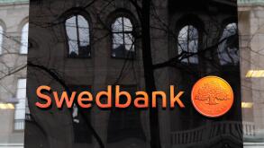 Stockholm, Sweden - April 2, 2015: Reflections at the Swedish bank Swedbank office exterior at Hamngatan.