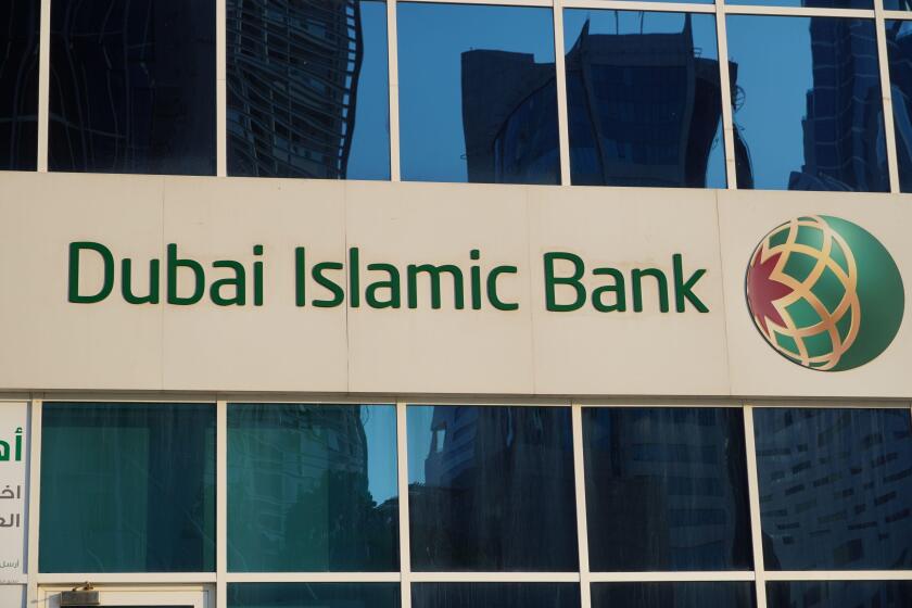 Dubai UAE December 2019 - Dubai Islamic Bank a major Middle Eastern banks building sign logo on large building on a sunny day.