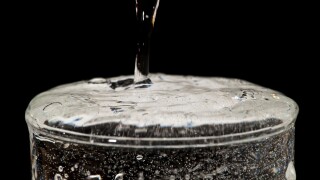 overflowing water glass