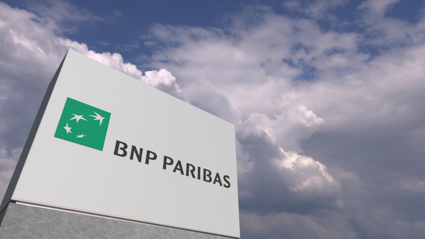 Logo of BNP PARIBAS on a stand against cloudy sky, editorial 3D rendering