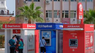 People using Ziraat Bankasi, YapiKredi and Akbank ATM machines in Kemer, Turkey