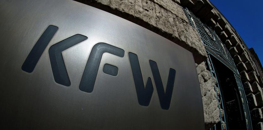 In this Tuesday, March 24, 2020 photo the logo of the 'KfW', Kreditanstalt fur Wiederaufbau, bank (Credit Institute for Reconstruction) is pictured in Berlin, Germany. (AP Photo/Michael Sohn)