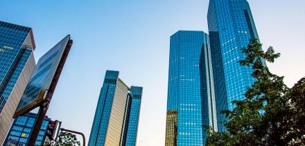 View to the tall glass buildings from the street road