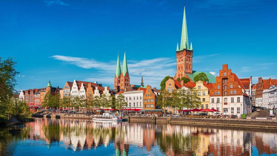 Historic skyline along the Trave river in the old town of Lubeck, Germany on a summer day