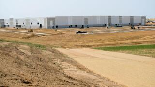 Commercial real estate building site in Aurora, Colorado; unfinished construction in progress.