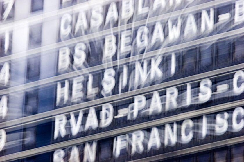 Info sign at the airport with destination Helsinki Aviv, zoom effect