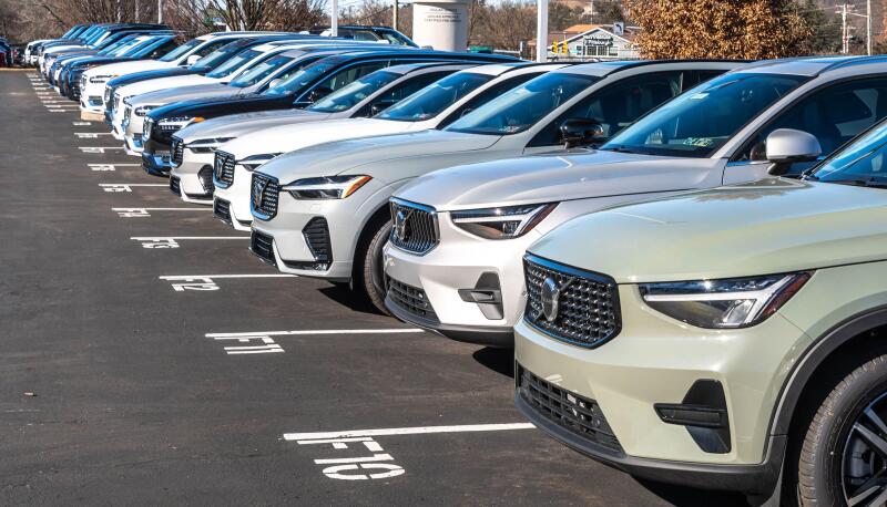 New Volvo vehicles lined up for sale at a dealership