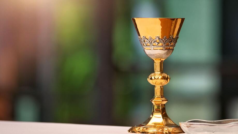 Chalice on the altar in church and empty space for text