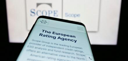 Stuttgart, Germany, 03-13-2023: Smartphone with website of European fund rating company Scope Group on screen in front of business logo. Focus on