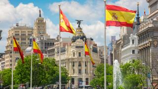 Madrid city center, view along the Calle de Alcala towards the Metropolis Hotel and surrounding architecture in the historic centre of Madrid, Spain.