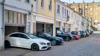 Mercedes cars outside garages in Petersham Mews, South Kensington, SW7, London. England