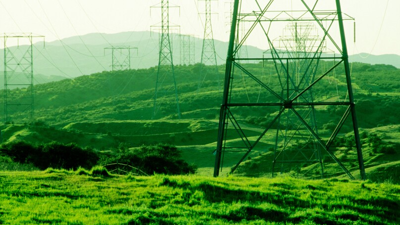 power poles Powerlines stretch over a southern california hillside