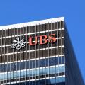 The logo of UBS AG can be seen from the street near their 1285 6th Ave headquarters building in New York City.
