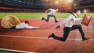 Businessman wins against a competitor slow like a snail