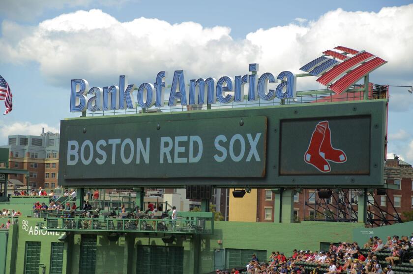 Bank of America scoreboard at Fenway Park in Boston, MA, United States with the hometeam's name and red sox logo.