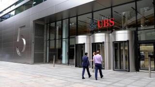 Entrance of 5 Broadgate UBS building exterior HQ headquarters sign people  financial services investment bank in the City of London UK   KATHY DEWITT