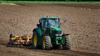 Tractor cultivating a field