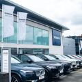 LONDON- JULY 31, 2023: Volvo car dealership-cars parked outside showroom with Volvo logo above. Swedish vehicle manufacturer.