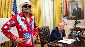 Kid Rock with Donald Trump in the Oval Office of the White House. President Donald Trump signs an Executive Order alongside Kid Rock in the Oval Office, Monday, March 31, 2025.