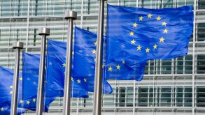 EU flags in front of European Commission in Brussels