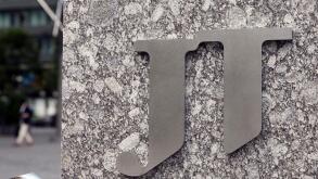 A picture taken on Oct.10, 2018 shows a Company Logo of Japan Tobacco Inc. in front of its Head office in Minato, Tokyo.( The Yomiuri Shimbun via AP Images )