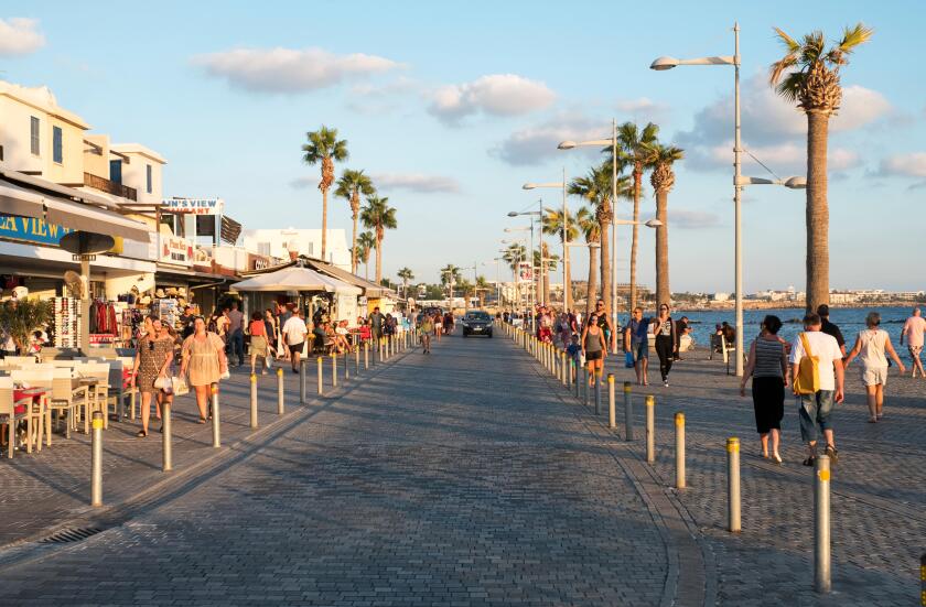 Tourists on the promenade in Kato Paphos, Paphos, Cyprus