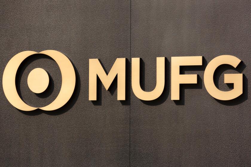 A new signboard of MUFG on display outside its branch on April 2, 2018, Tokyo, Japan. Mitsubishi UFJ Financial Group Inc. changed the name of Bank of Tokyo-Mitsubishi UFJ to MUFG Bank after 11 years of merger and complaints from customers saying that the