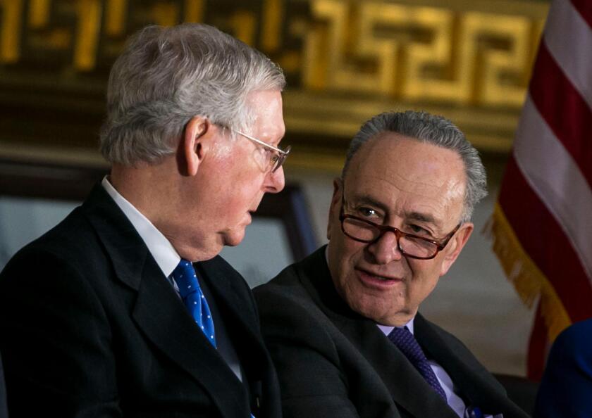 Senate Majority Leader Mitch McConnell, a Republican from Kentucky, and Senate Minority Leader Chuck Schumer, a Democrat from New York, speak during a congressional Gold Medal ceremony for former Senator Bob Dole, in Washington D.C., U.S., on Wednesday, J