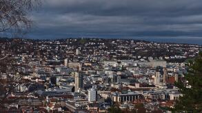 Beautiful aerial panoramic view of densely populated city center of Stuttgart including church Stiftskirche, town hall and tower Bismarckturm.