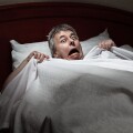 Man startled awake by intruder