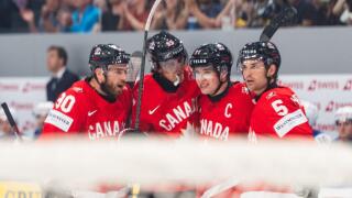 FRIBOURG, FRIBOURG - MAY 28: Canada players celebrate for the first time after Macklin Celebrini scored during the 2026 IIHF World Championship quarterfinal match between Canada and the United States at BCF Arena on May 28, 2026 in Fribourg, Fribourg, Swi