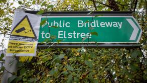 Public Bridleway sign near Elstree, Hertforshire, with notice about CCTV to deter fly-tipping