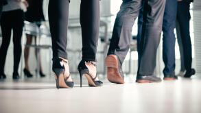 close up. a variety of business people passing through the office business center.