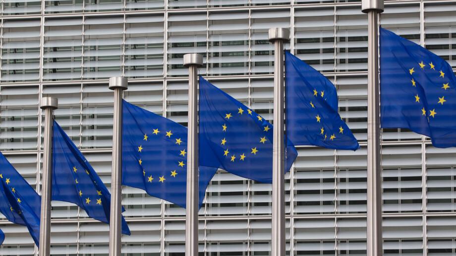 European flags in front of the Berlaymont building, headquarters of the European commission in Brussels, Belgium