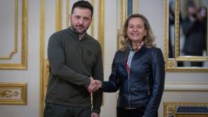 President of the European Investment Bank Nadia Calvino shakes hands with Ukraine's President Volodymyr Zelenskyy during their meeting in Kyiv, Ukraine, Monday, Feb. 10, 2025. (AP Photo/Efrem Lukatsky)