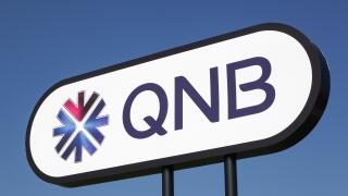 Aarhus, Denmark - March 30, 2019: QNB logo on a panel. QNB, Qatar National Bank is a Qatari commercial bank headquartered in Doha, Qatar
