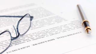 Pen and Spectacles with Disclosure Agreement