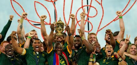 South African President Cyril Ramaphosa lifts the Webb Ellis Cup with the South Africa players following victory in the Rugby World Cup 2023 final match at the Stade de France in Paris, France. Picture date: Saturday October 28, 2023.
