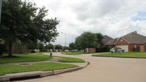 American suburbs. Random street in the neighborhood on a cloudy day.